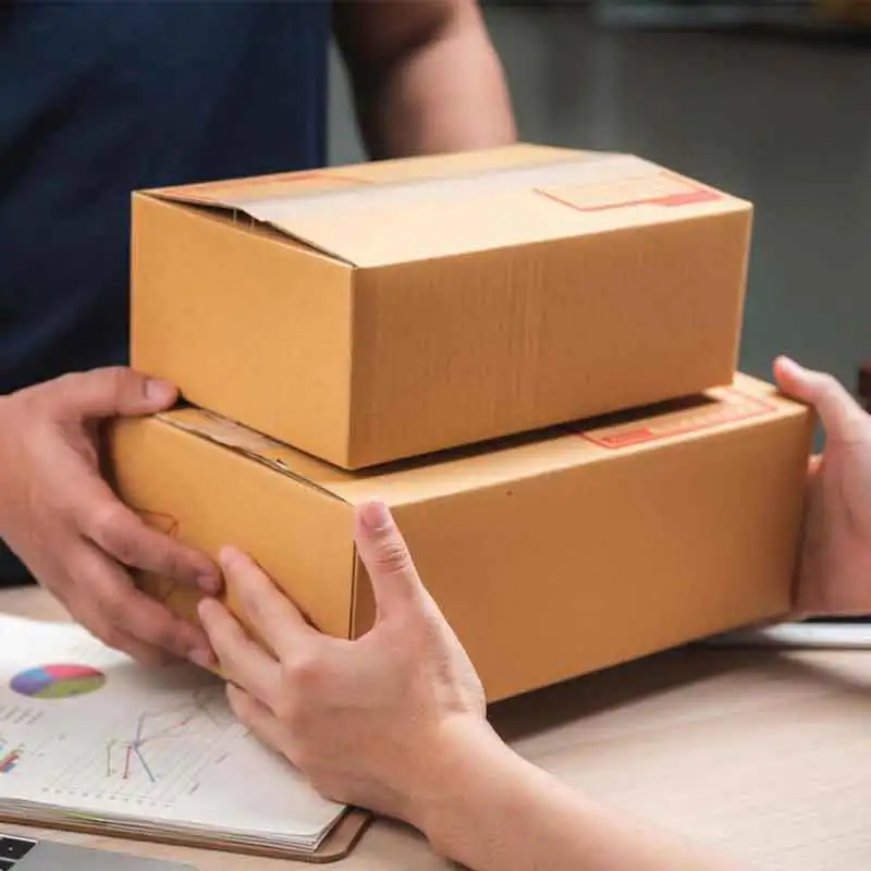 Warehouse worker preparing a parcel for shipment